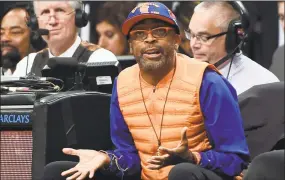  ?? Kathy Kmonicek / Associated Press ?? Spike Lee reacts during a Knicks game against the Nets in November 2014.