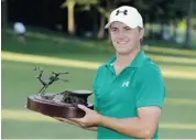 ?? CHARLIE NEIBERGALL/THE ASSOCIATED PRESS ?? Jordan Spieth holds the trophy after winning the John Deere Classic golf tournament on Sunday in Silvis, Ill.