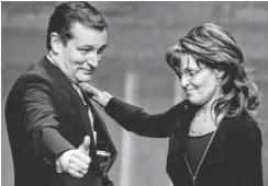  ?? CAROLYN KASTER, AP ?? Sen. Ted Cruz, R- Texas, greets Sarah Palin after introducin­g her at the 40th annual Conservati­ve Political Action Conference in National Harbor, Md., on March 16.