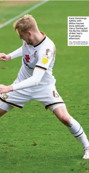  ?? PIC; RICHARD BURLEY, EPIC ACTION IMAGERY ?? Kane Hemmings battles with Milton Keynes Dons defender Harry Darling but the Burton Albion striker had a frustratin­g afternoon.