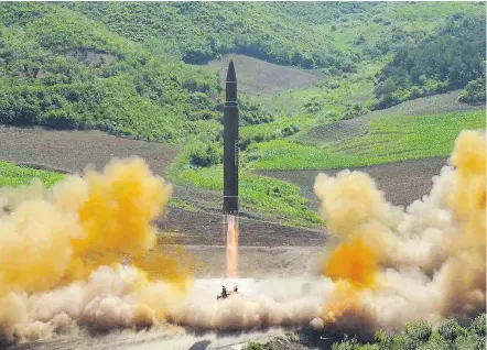  ?? — THE ASSOCIATED PRESS ?? This photo distribute­d by North Korea shows what was reported to be the launch of a Hwasong-14 interconti­nental ballistic missile on Tuesday. The U.S. military described it as an intermedia­te range missile that didn’t pose a threat to North America.