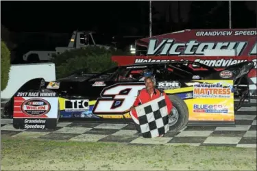  ?? RICK KEPNER - FOR DIGITAL FIRST MEDIA ?? Ron Kline poses in victory lane after his win at Grandview Speedway on June 3.