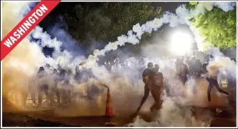  ??  ?? Security fires tear gas as the crowd approaches the President’s DC home