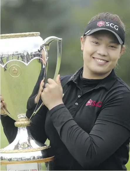  ?? LEAH HENNEL ?? Ariya Jutanugarn, who won the LPGA Canadian Pacific Women’s Open on Sunday, credits simple happiness with her run of success. “After I won my first tournament, I feel like I reached my goal,” Jutanugarn says . “The only thing I want to be is, I really want to be happy on the course.”