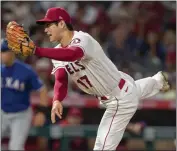  ?? ALEX GALLARDO – THE ASSOCIATED PRESS ?? Angels starting pitcher Shohei Ohtani allowed two runs but got little help in Thursday’s shutout loss to the Rangers. He gave up eight hits but fanned 11Texas batters.