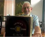  ?? PHOTOS: ANDRE CHUMKO/STUFF ?? Robin Gwynn with the 19th-century stamp album he bought four years ago.