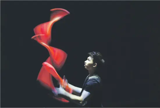  ?? Picture: AFP ?? FOCUSED. A member of China’s Guangxi cultural and art troupe performs during an internatio­nal music festival at the Abdulhusai­n Abdulredha theatre in Kuwait City on Sunday.