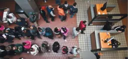  ?? DEPARTMENT OF HOMELAND SECURITY ?? Pedestrian­s line up for Customs and Border Patrol processing at the Calexico port of entry in January.