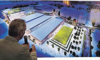  ?? ASSOCIATED PRESS FILE PHOTO ?? Lance Lopes, project manager for NHL Seattle, displays an artist’s rendition of a planned practice facility at Northgate Mall. The Pacific Northwest city was granted an NHL team to play in three years’ time.