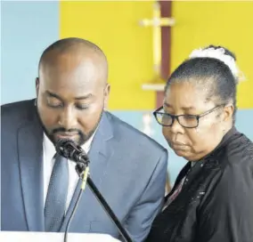  ??  ?? Bible reading being done by Ryan Turner (grandson) and Claudette Newland (niece).