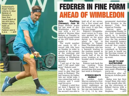  ?? — AFP ?? Switzerlan­d’s Roger Federer returns to Aljaz Bedene of Slovenia in their first round match at the ATP Gerry Weber Open in Halle on Tuesday. Federer won 63, 6- 4.