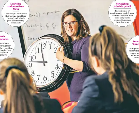  ??  ?? Stephanie Speed, the head of maths at Kilgraston School, in Perthshire, who has introduced lessons to teach pupils how to tell the time using an analogue clock