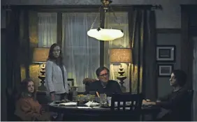  ?? A24 ?? Charlie (Milly Shapiro, left), Annie (Toni Collette), Steve (Gabriel Byrne) and Peter Graham (Alex Wolff) fall under a family curse in “Hereditary.”