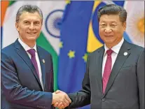  ??  ?? DEPENDENCI­A. De Macri con su par chino, Xi Jinping.