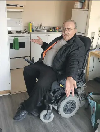  ?? BLAIR CRAWFORD ?? Adam Traub says his new $14,000 wheelchair is too big and he can barely navigate it around his apartment. He also complains that it doesn’t fit on a regular OC Transpo bus, limiting his ability to get around town. The new chair currently sits unused...