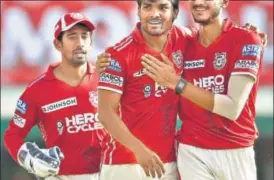  ?? BCCI ?? KXIP’s Sandeep Sharma (centre) is congratula­ted by Axar Patel (right) after he dismissed Daredevils’ Kagiso Rabada at the PCA Stadium in Mohali on Sunday.