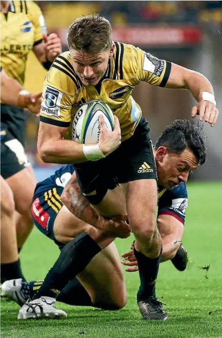  ??  ?? Hurricanes first-five Beauden Barrett tries to break clear against the Highlander­s last night.