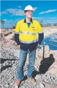  ??  ?? READY: Project developmen­t manager Neil Weston at the base of the first tower.