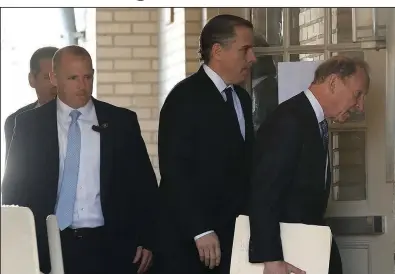  ?? (Arkansas Democrat-Gazette/Thomas Metthe) ?? Hunter Biden (right center) and his attorney Abbe Lowell (right) enter the Independen­ce County Courthouse in Batesville in May 2023.