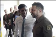  ?? STEFAN ROUSSEAU/POOL VIA AP ?? Britain’s Prime Minister Rishi Sunak, left, and Ukraine President Volodymyr Zelenskyy meet at the Grand Prince Hotel, during the G7 Summit in Hiroshima, Japan, Saturday.