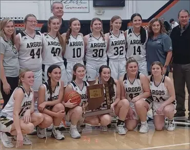  ?? PHOTO PROVIDED ?? The Argos HS girls basketball team and coaches pose with the sectional trophy after defeating Triton in overtime Saturday.