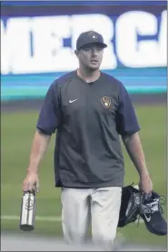  ?? MORRY GASH — THE ASSOCIATED PRESS ?? Milwaukee Brewers’ Corey Knebel walks to the dugout during a practice session Monday, July 6, 2020, at Miller Park in Milwaukee.