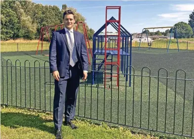  ??  ?? Hinckley and Bosworth MP Dr Luke Evans visiting the newly-painted play park in Barwell