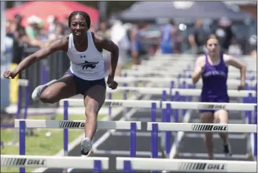  ?? (NWA Democrat-Gazette/J.T. Wampler) ?? Kinleigh Hall of Springdale Har-Ber competes in the 100-meter hurdles Wednesday at the state high school heptathlon at Ramay Junior High School in Fayettevil­le. Hall sits in third place after four events in the heptathlon with 2,519 points. The heptathlon concludes today with three events — high jump, shot put and the 800-meter run.