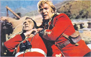  ?? Picture: REX ?? CRACKING: Stanley Baker and Michael Caine in a scene from the war film Zulu