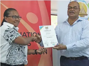  ?? Photo: Simione Haravanua ?? Weightlift­ing Fiji president Della Shaw-Elder receives WF’s certificat­e of accreditat­ion from the Permanent Secretary for Youth and Sports Maritino Nemani on July 9, 2020.