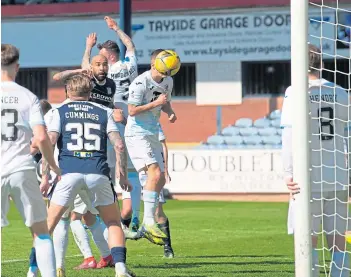  ??  ?? Dundee’s Liam Fontaine beats the Raith defence to make it 2-0