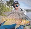  ??  ?? Dan Sleeman with one of the 3000 Tilapia caught as part of the Tilapia Busters tournament.