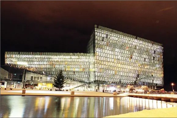  ??  ?? This Dec 1, 2011 file photo, shows an exterior night view of the Harpa concert hall and conference center in Reykjavik, Iceland. (AP)