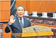  ?? — Bernama photo ?? Former Bukit Mas Member of Parliament, Datuk Mutang Tagal taking oath as the 20th president of the Dewan Negara on Monday.