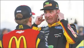  ?? Matt Sullivan / Getty Images ?? Clint Bowyer, right, talks with Jamie McMurray on Friday during qualifying for the Hollywood Casino 400 at Kansas Speedway in Kansas City, Kan.