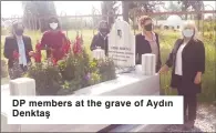  ??  ?? DP members at the grave of Aydın Denktaş