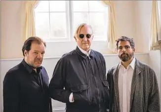  ??  ?? PERCUSSION­IST Jay Bellerose, left, Burnett, and keyboardis­t and electronic music composer Keefus Ciancia have collaborat­ed on the “True Detective” television series, among other projects.