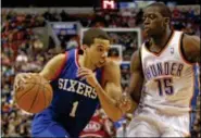  ?? AP File Photo ?? 76ers’ Michael Carter-Williams, left, a Massachuse­tts native, will play at his hometown arena for the first time in his career.