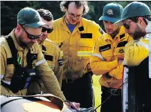  ?? PARKS CANADA PHOTO ?? Parks Canada has 75 firefighte­rs and six helicopter­s battling the Verdant wildfire near Sunshine Village.