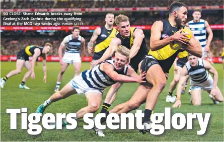  ?? Picture: GETTY ?? SO CLOSE: Shane Edwards breaks away from Geelong’s Zach Guthrie during the qualifying final at the MCG two weeks ago.