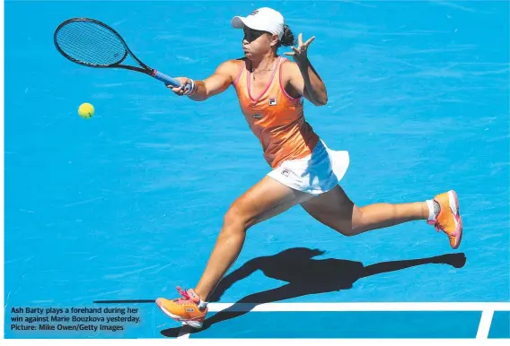  ??  ?? Ash Barty plays a forehand during her win against Marie Bouzkova yesterday. Picture: Mike Owen/Getty Images