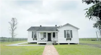  ?? THE ASSOCIATED PRESS FILES ?? Rain clouds gather over the childhood home, dating to the mid 1930s, of singer Johnny Cash, in Dyess, Arkin 2014.
The country music icon Cash’s boyhood home is being considered as a nominee for inclusion on the National Register of Historic Places....