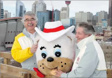  ?? Lorraine Hjalte/calgary Herald ?? Ex-Olympic mascot chief Lane Kranenburg, left, and ’88 organizing committee vice-president Jerry Joynt on Monday join Hidy, who, with Howdy, is coming out of retirement Feb. 13 to celebrate the 25th anniversar­y of the ’88 Winter Games.