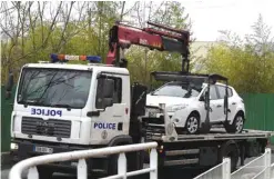  ??  ?? VILLEJUIF, France: This file photo taken on March 20, 2016, shows a car transporte­d by a police vehicle arriving for the reconstitu­tion of the murder of Aurelie Chatelain, on March 20, 2016. —AFP
