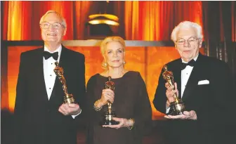  ?? KEVORK DJANSEZIAN/GETTY IMAGES ?? Filmmaker Roger Corman, left, actress Lauren Bacall and cinematogr­apher-director Gordon Willis received honorary Oscars in 2010 for their outstandin­g careers in Hollywood.