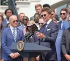  ?? MANUEL BALCE CENETA/AP ?? President Joe Biden listens as Tom Brady speaks during the Buccaneers visit to the White House on Tuesday.