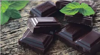  ?? DREAMSTIME ?? Dark chocolate contains both tryptophan and antioxidan­ts, which means it’s great for our mental and physical health.