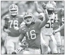  ?? AP/RICHARD SHIRO ?? Clemson quarterbac­k Trevor Lawrence (16) reacts after scoring a touchdown during the first half of a game Saturday against Florida State in Clemson, S.C.