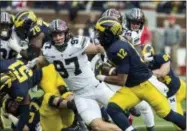  ?? ASSOCIATED PRESS FILE ?? Ohio State defensive lineman Nick Bosa (97) chases Michigan running back Chris Evans (12). Bosa was selected to the AP Preseason All-America team.