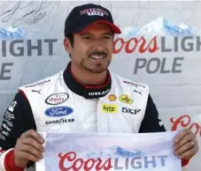  ?? TOM E. PUSKAR/THE ASSOCIATED PRESS FILE PHOTO ?? Alex Tagliani celebrates winning the pole for the NASCAR Xfinity Series Nationwide Children’s Hospital 200 auto race in August.